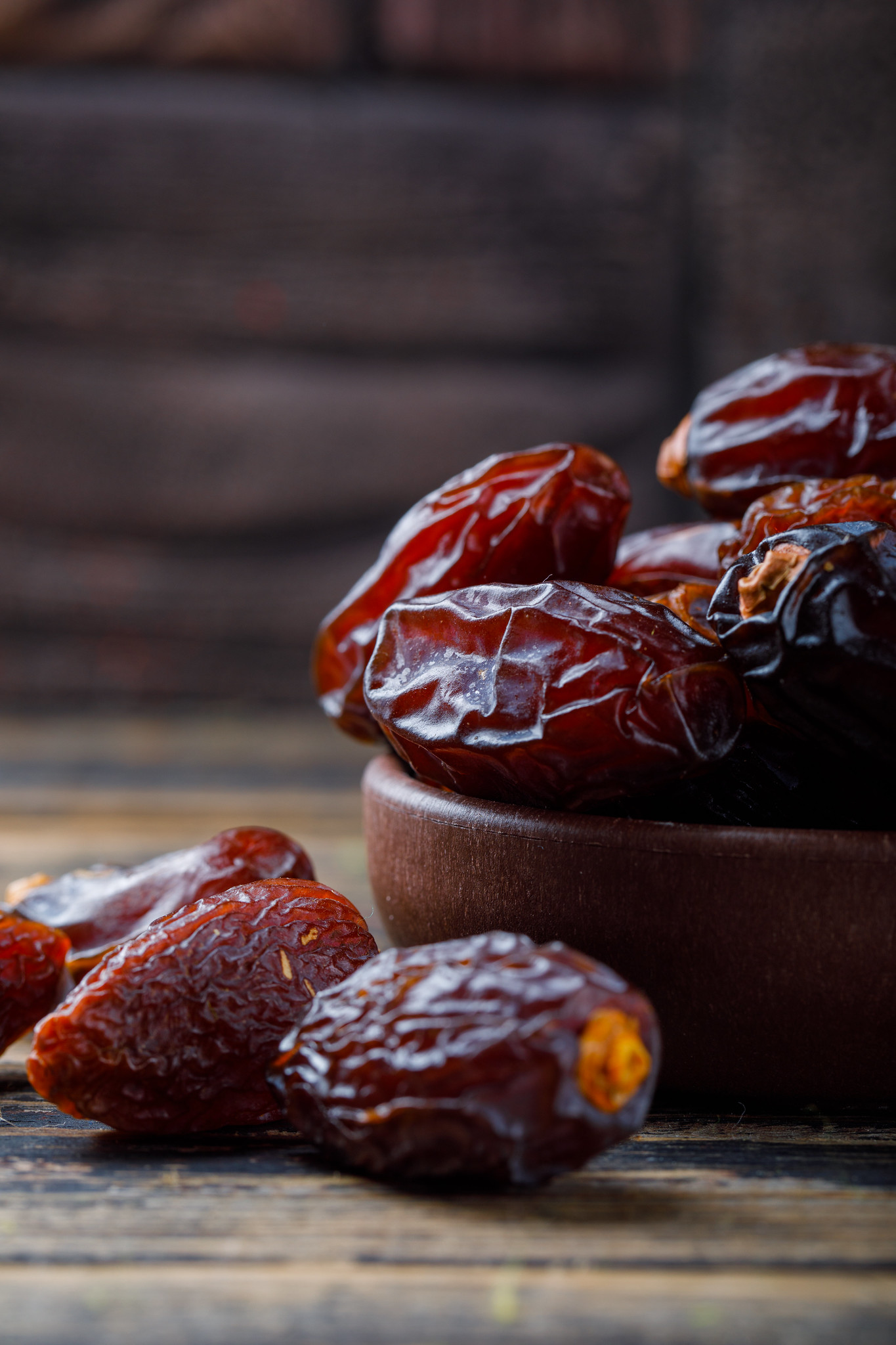 Medjool dates in a wooden bowl used for traditional ma’amoul cookie filling